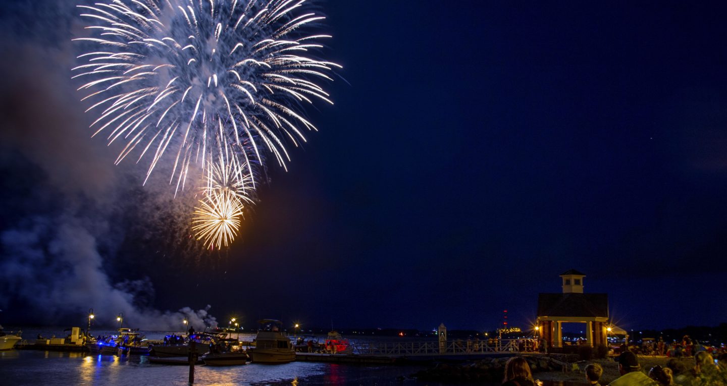 Fireworks in the night sky over the ocean