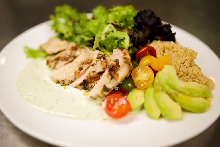Grilled chicken and a salad near Yorktown Beach Hotel, a hotel near Williamsburg.